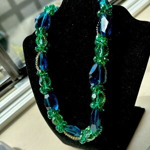 Jewel, toned necklace, beautiful colors, and design reflecting on many facets
